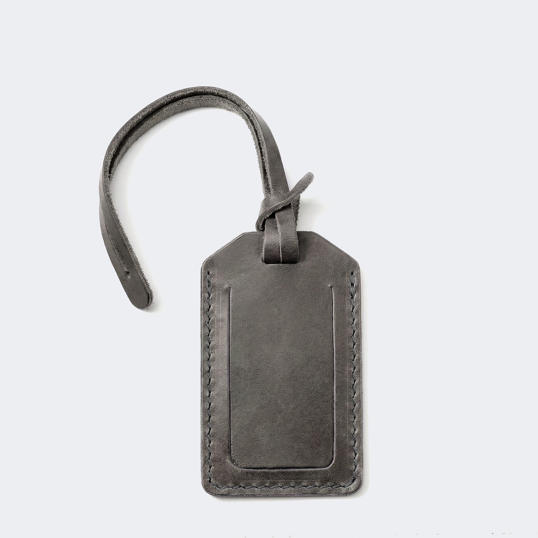 Roarcraft kapaklı deri valiz etiketi, şık gri renk desenli ve sağlam dikiş detaylarıyla