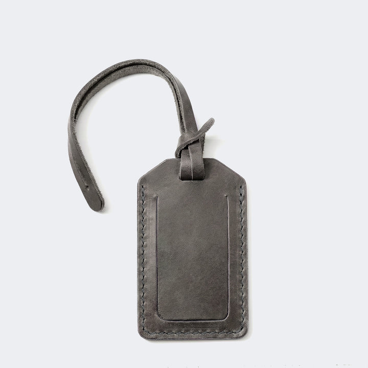 Roarcraft kapaklı deri valiz etiketi, şık gri renk desenli ve sağlam dikiş detaylarıyla